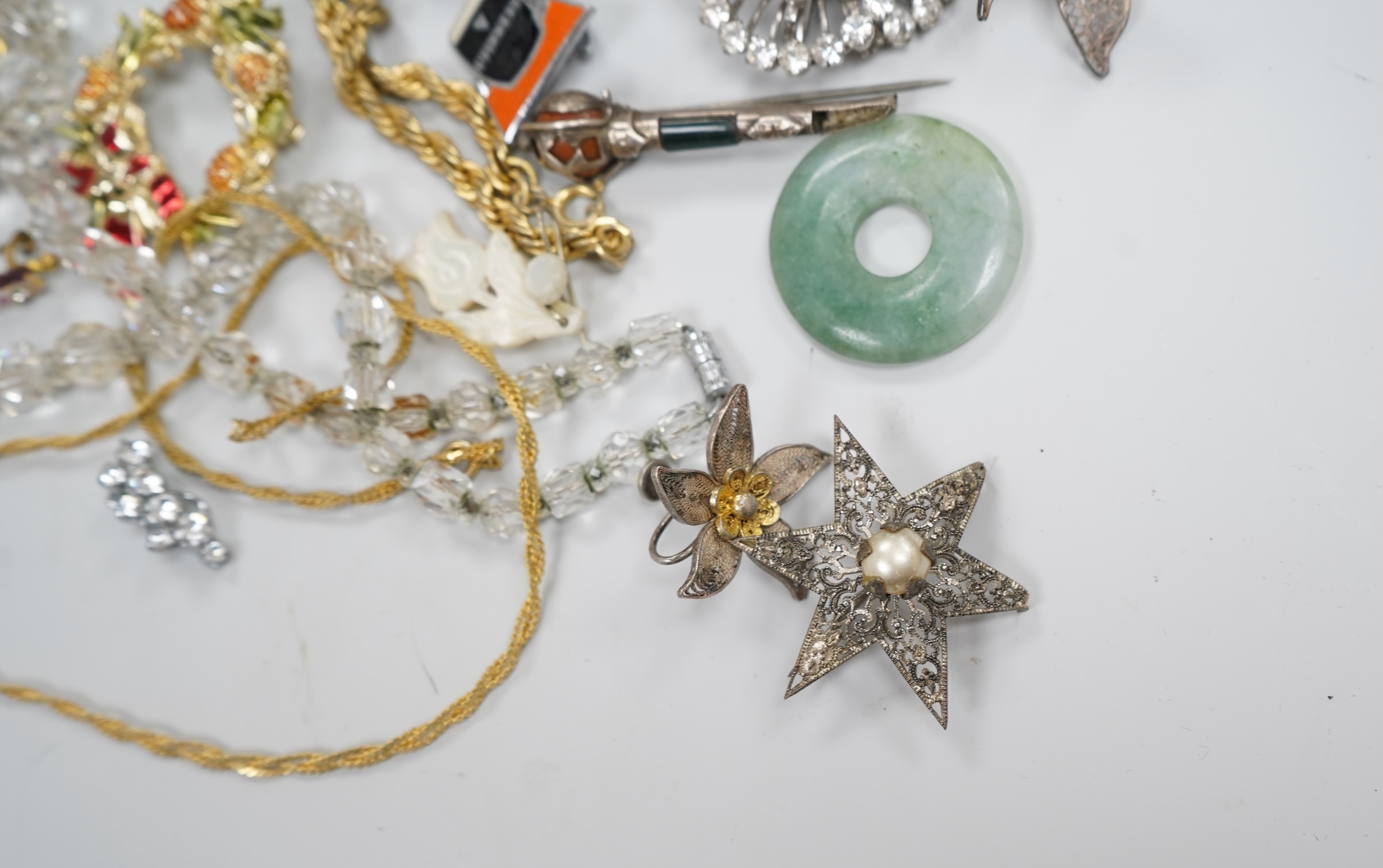 A group of costume jewellery and collector's items in a Japanese lacquer box